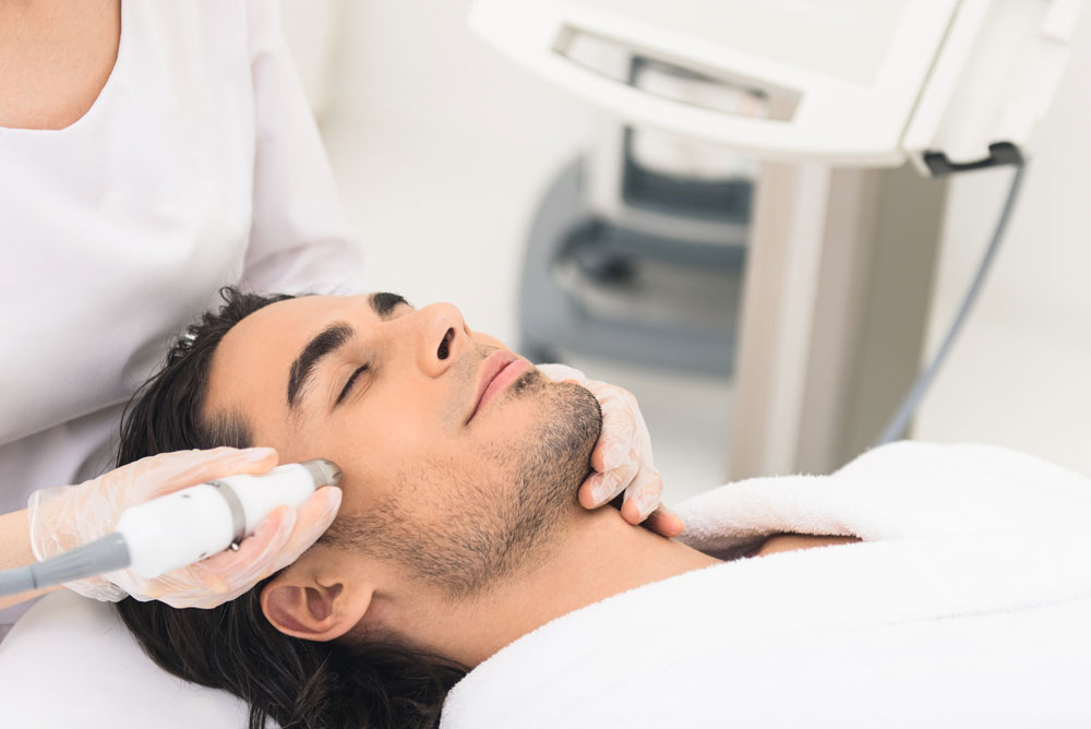 man receiving laser treatment